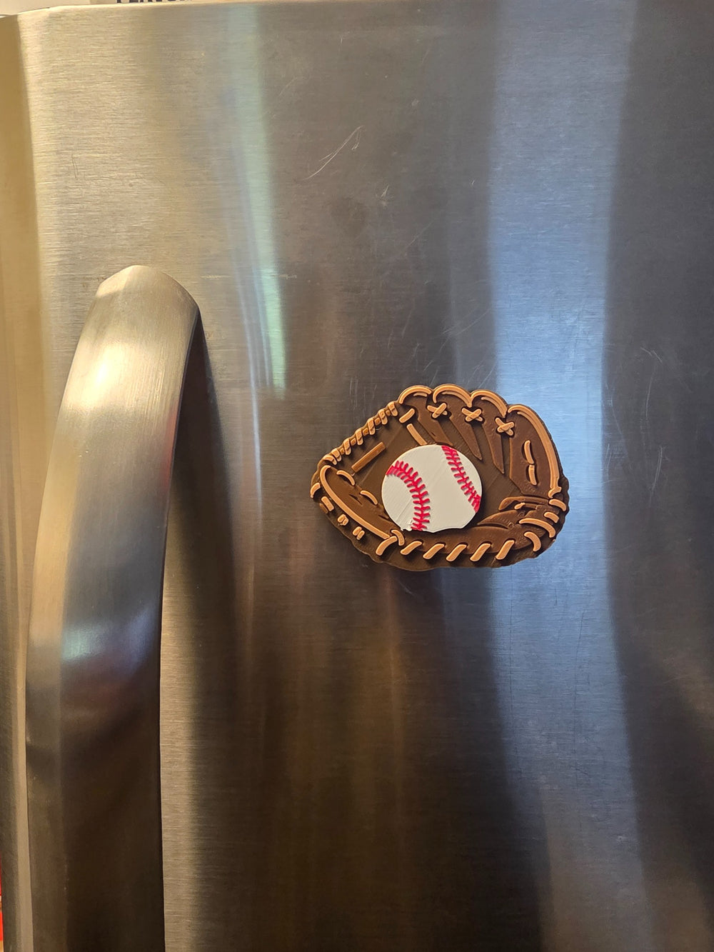 Baseball Glove magnet on a stainless steel refrigerator