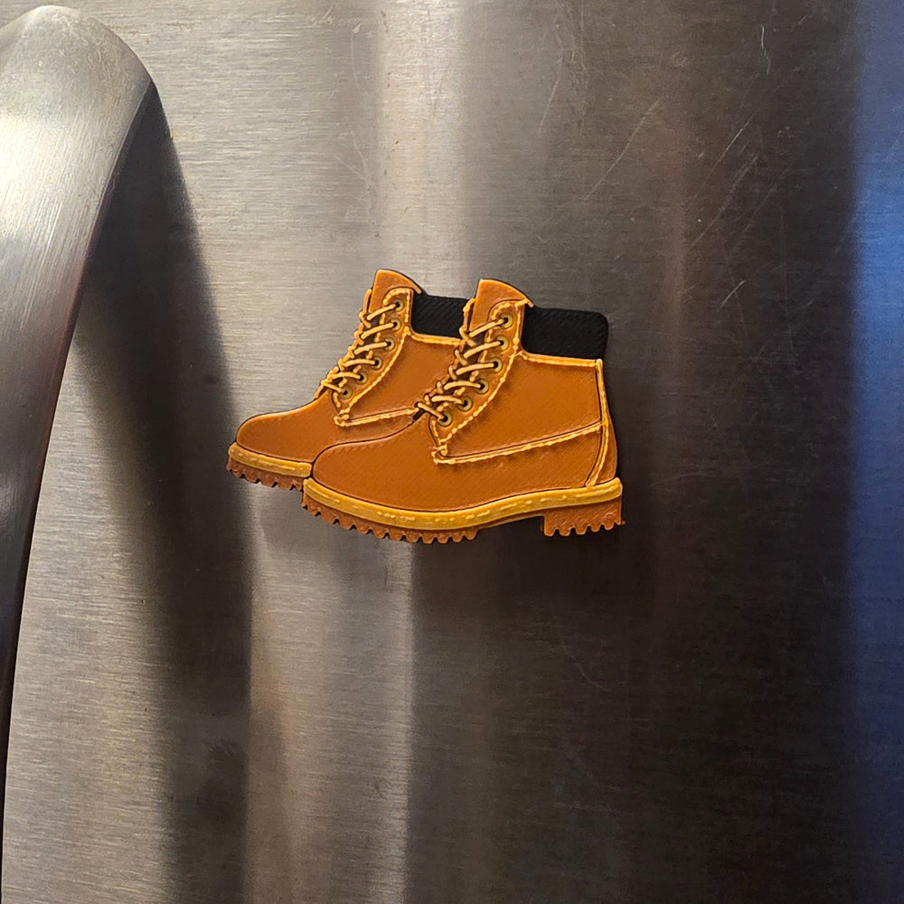 Boots 3D printed refrigerator magnet on a stainless steel refrigerator